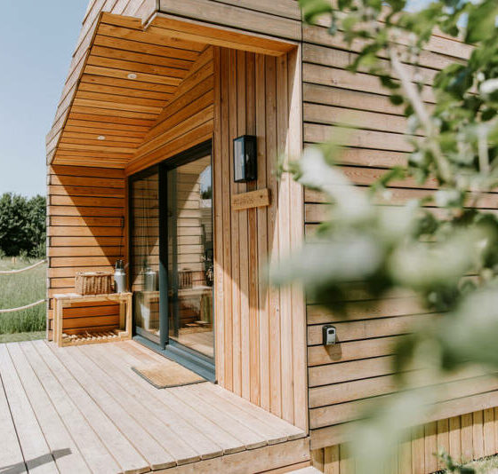 Luxury glamping cabin with wood-fired hot tub at The Meadows at Polehanger, Bedfordshire.