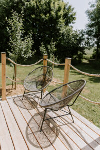 Spring sunshine on cabin decking at The Meadows at Polehanger Bedfordshire