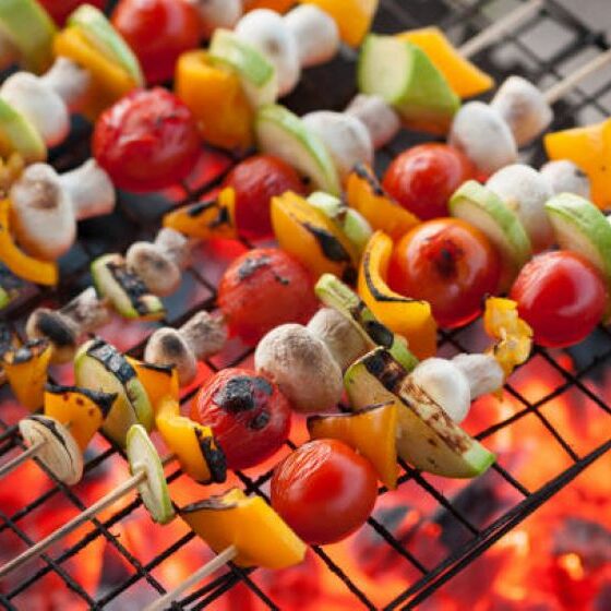 Vegetarian kebab. Grilled vegetables kebab. Burning red coals