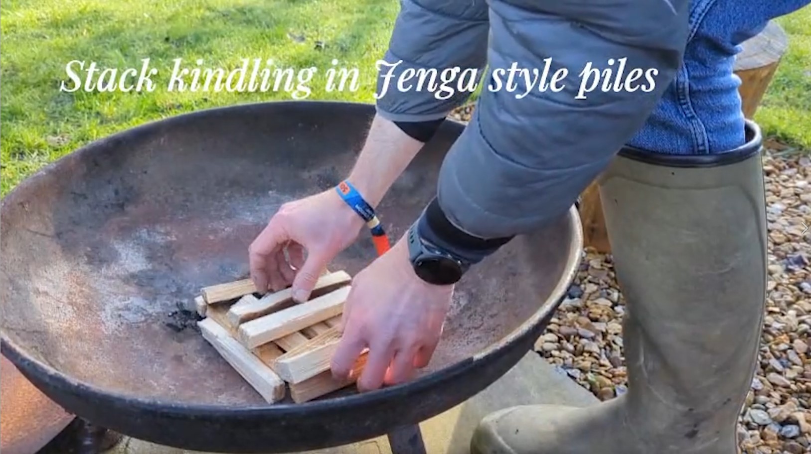 Kindling stacked Jenga-style ready to light a fire pit