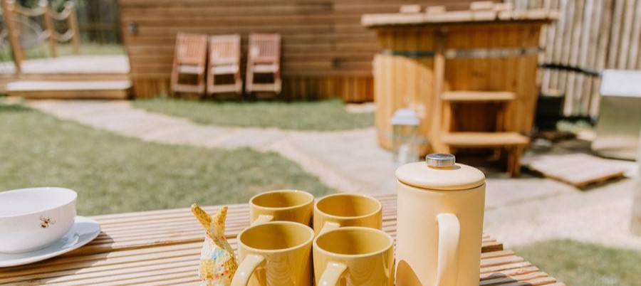 Morning coffee outside your cabin at our countryside escape in Bedfordshire