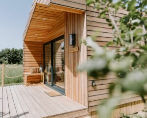 Luxury glamping cabin with wood-fired hot tub at The Meadows at Polehanger, Bedfordshire.