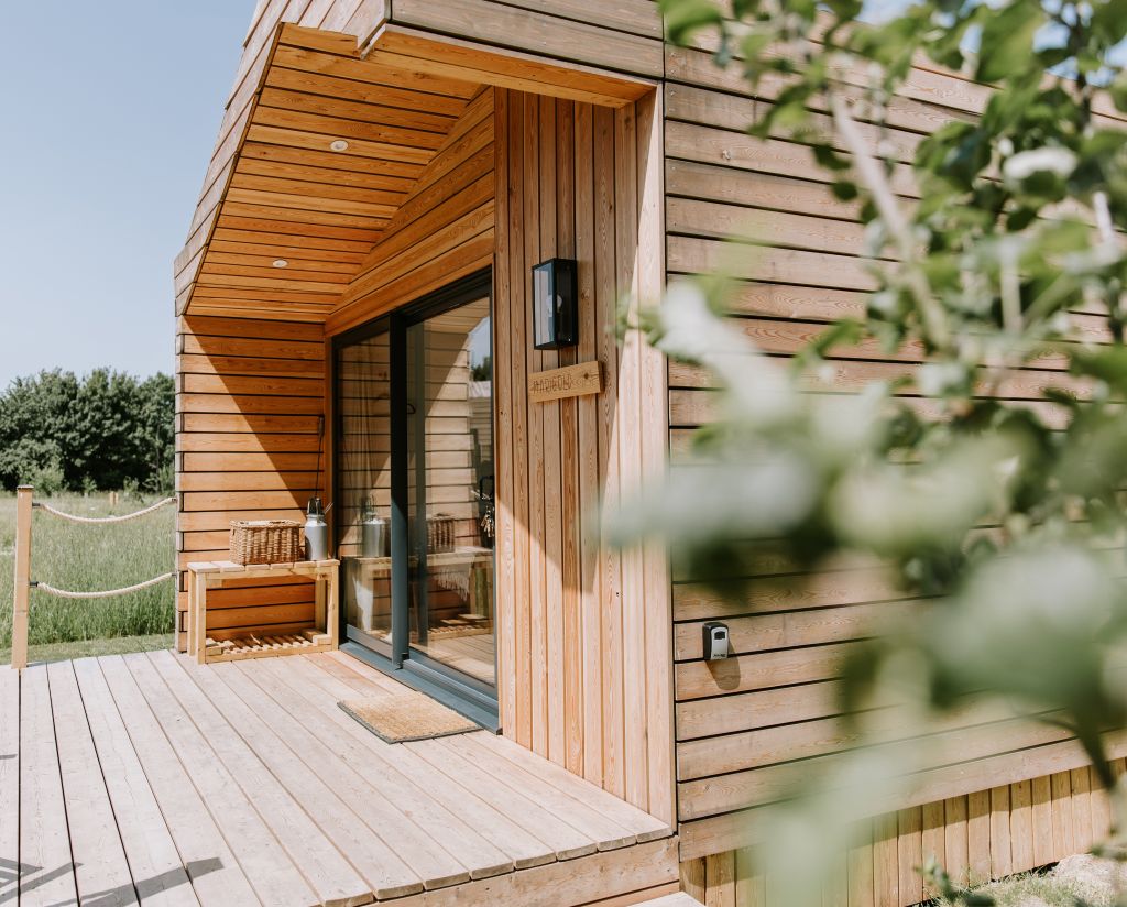 Luxury glamping cabin with wood-fired hot tub at The Meadows at Polehanger, Bedfordshire.