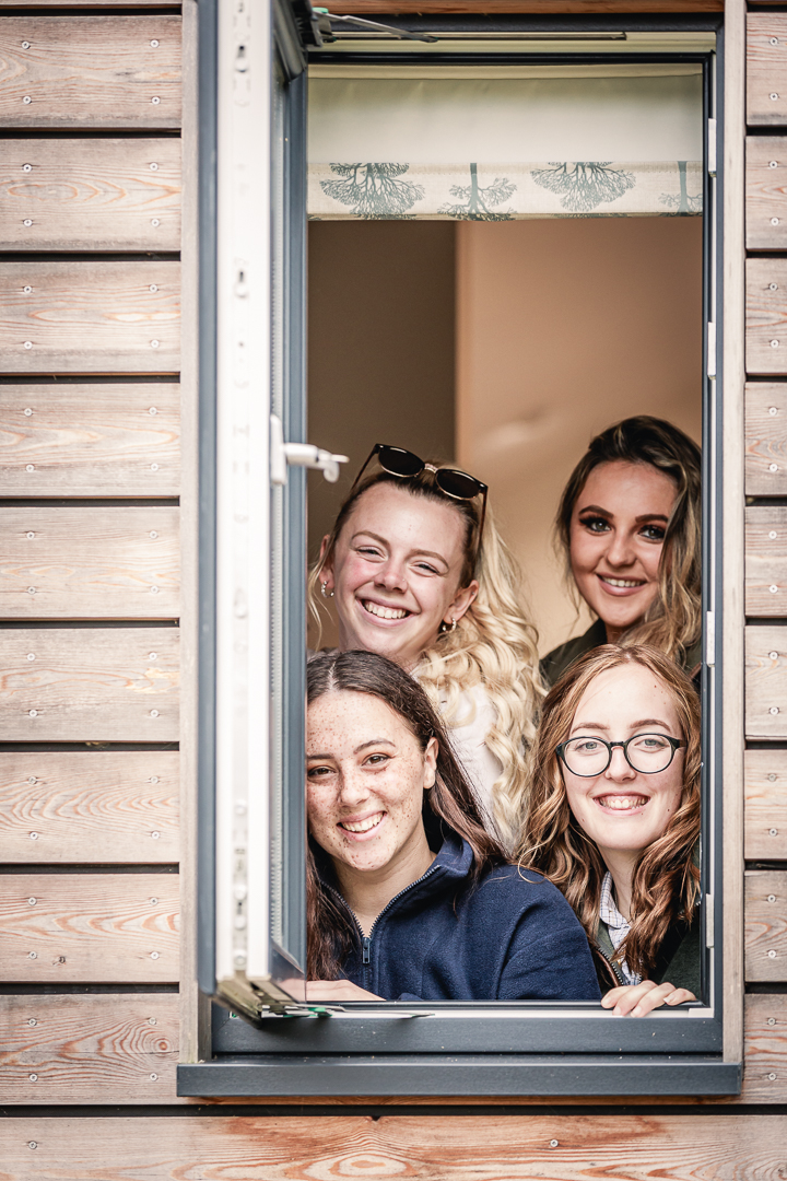 Friends enjoying a luxury glamping hen weekend at The Meadows at Polehanger